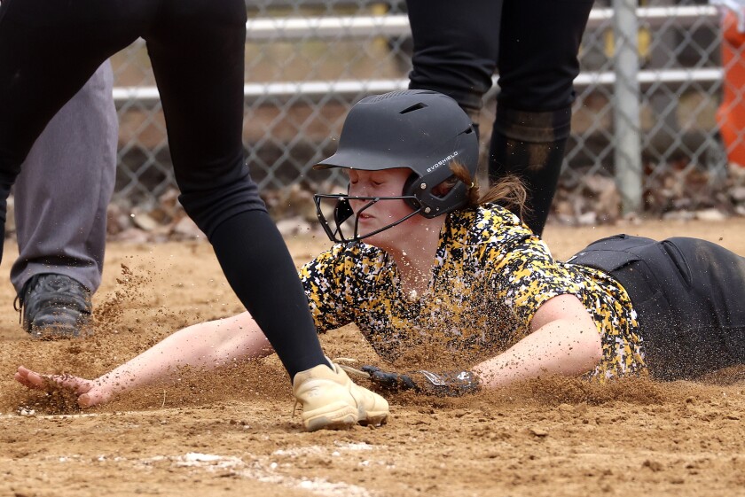 Northwestern softball players in action.