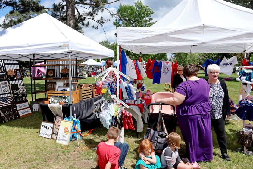 People attend Arts in the Park on Sunday, June 26, 2022, at Gregory Park in Brainerd.