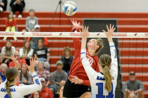 Willmar freshman Brielle Ogdahl, 10, goes up to attack the ball during a Central Lakes Conference match against Sartell on Tuesday, Sept. 27, 2022 at the Big Red Gym at Willmar High School.