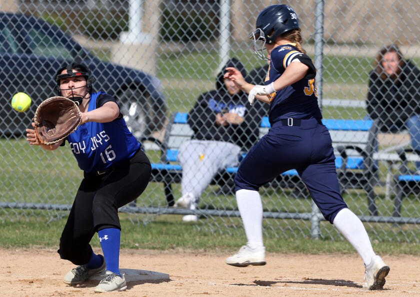 The Minnesota West Lady Jays first baseman Taylor Ponto (16) catches the throw for an out on Rochester Community and Technical College batter Isabelle Hahn during a Tuesday afternoon game.