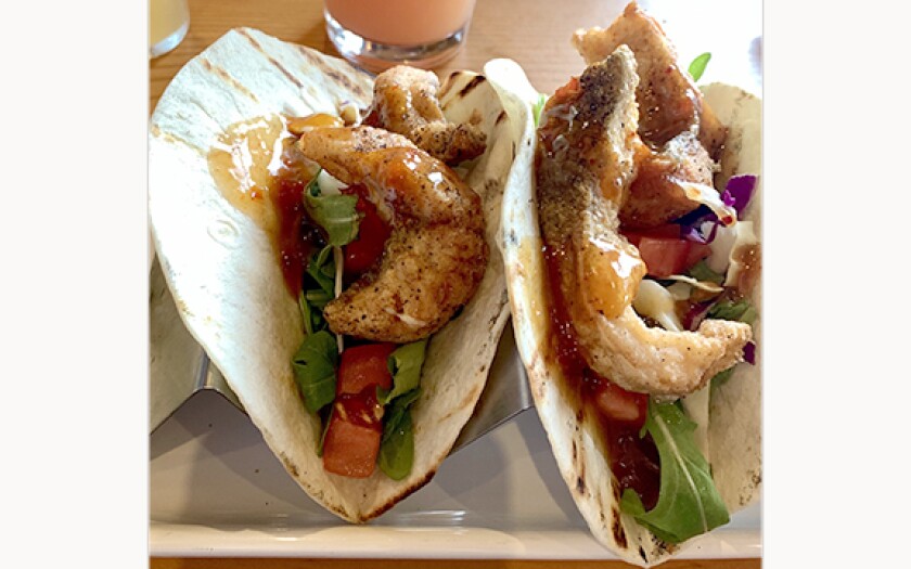 two soft shell tacos seen from above
