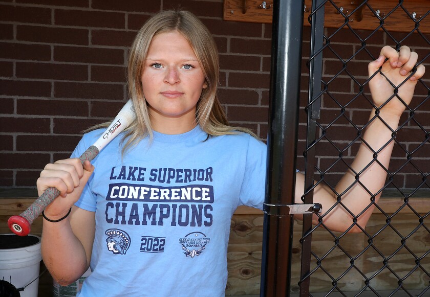 Superior’s Emma Raye poses in her dugout at the NBC Spartan Sports Complex