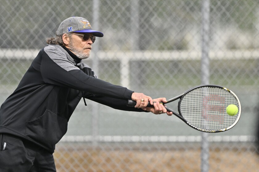 Man playing Tennis.