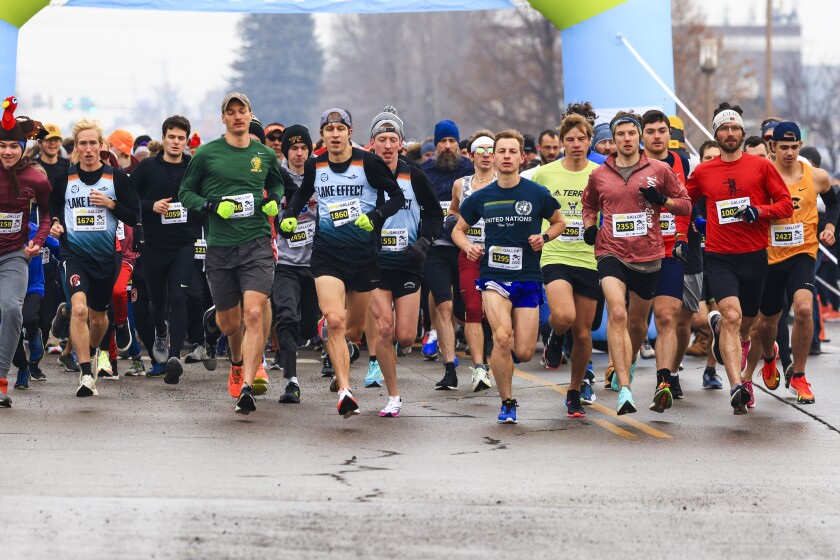 people running road race in Thankgiving themed clothing