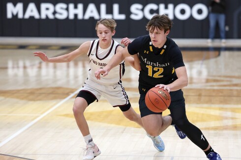 Player drives to hoop.