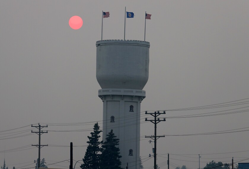 080221.N.BD.HazyRedSunBrainerdWaterTower2.jpg