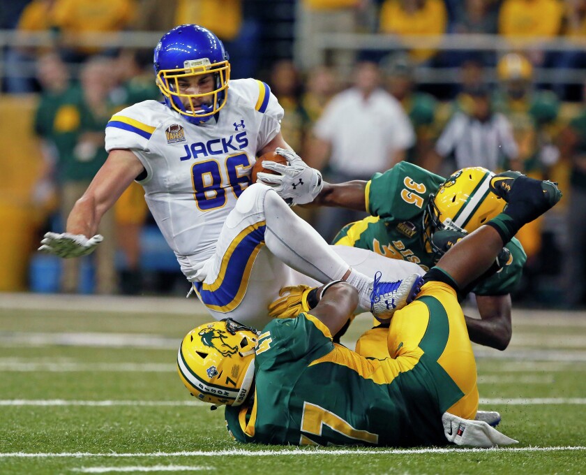 South Dakota State's Dallas Goedert breaks away from North Dakota State's Tre Dempsey after a reception Saturday, Oct. 15, 2016, at the Fargodome. David Samson / The Forum