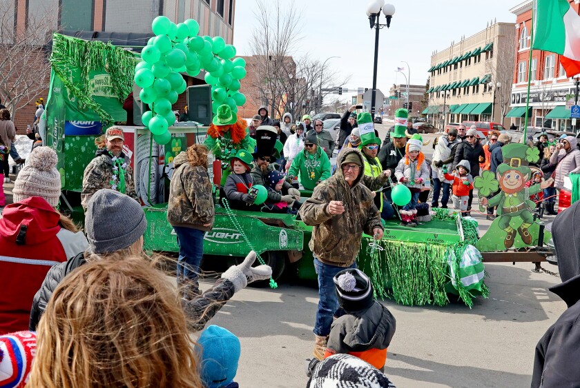 People celebrate St. Patrick's Day with a parade Saturday, March 12, 2022, in downtown Brainerd.