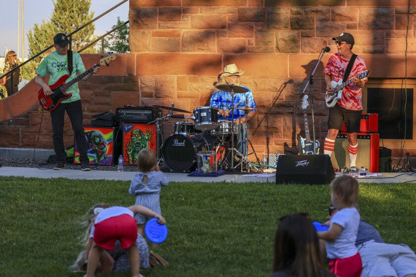 People outdoors at historic mansion