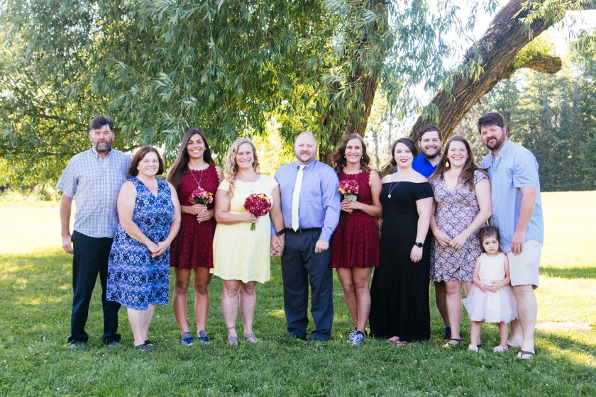 The Clemmers pose for a family photos in their backyard.