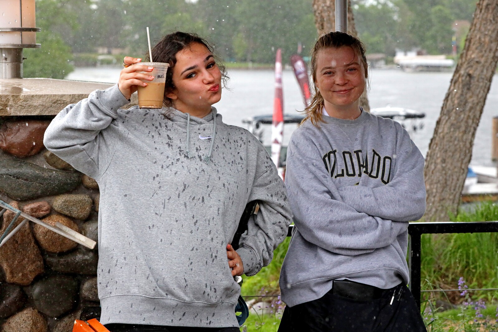 People seek shelter from a sudden rain shower