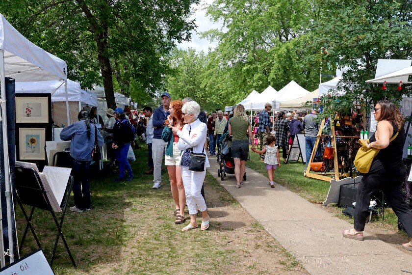 People attend Arts in the Park on Sunday, June 26, 2022, at Gregory Park in Brainerd.