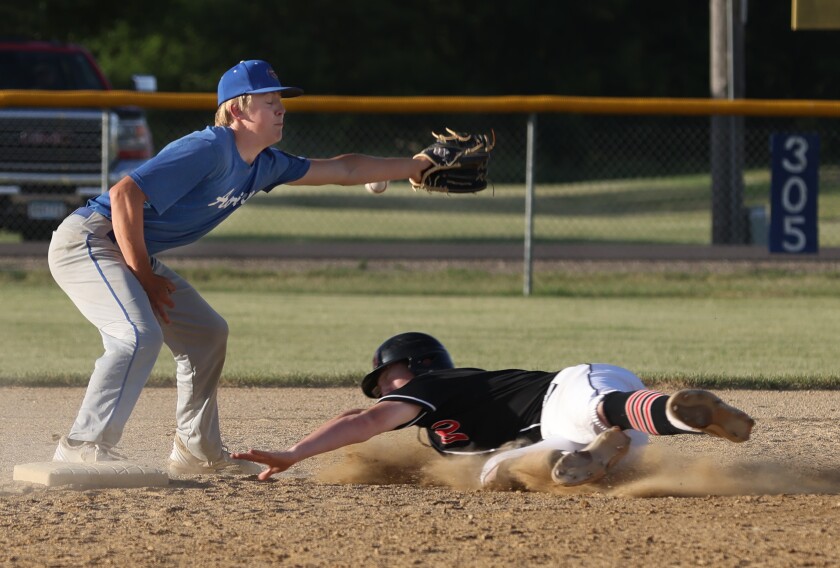 Adrian Post 32 second baseman Reece Carlson just misses the
catch as Kent Lais from visiting Worthington American Legion senior Post 5 slides safe onto the base Thursday evening.