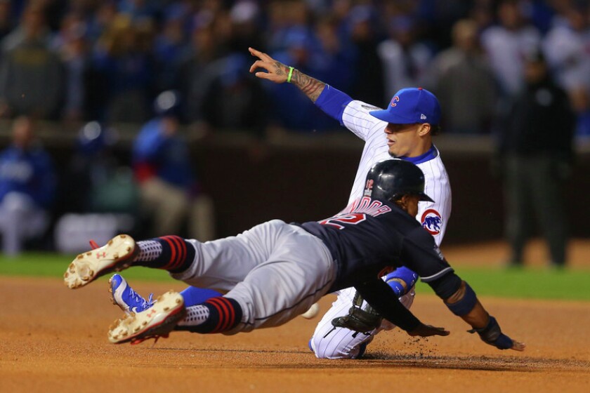 Cleveland Indians shortstop Francisco Lindor (12) is caught stealing second base against Chicago Cubs second baseman Javier Baez (top) during the sixth inning in game four of the 2016 World Series at Wrigley Field in Chicago. Photo by Dennis Wierzbicki-USA TODAY Sports