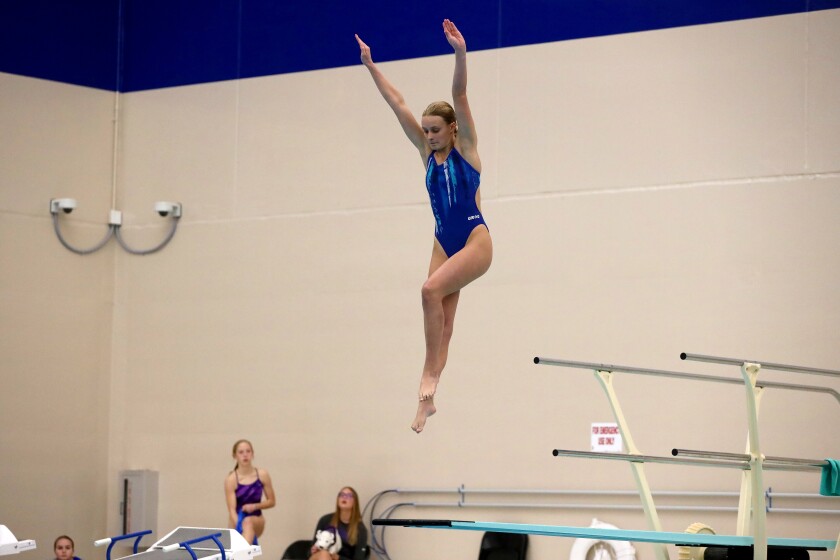 Brainerd's Evi Helsene dives during the Section 8-2A Girls Swimming and Diving finals Saturday, Nov. 12, 2022, at Brainerd High School.