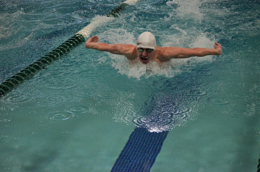 Midget junior swimmer Isaac Ellerkamp swims the butterfly leg of the 200-yard IM in a dual against Bismarck Legacy on Thursday, Feb. 8 at the West River Community Center. (Shelby Reardon / The Dickinson Press)