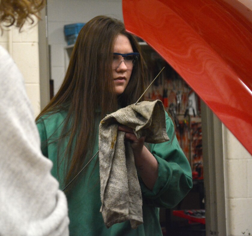 Serena Johnson checks a car's oil levels on Jan. 18, during the Basic Auto for Women Only class at Bemidji High School. (Jordan Shearer | Bemidji Pioneer)