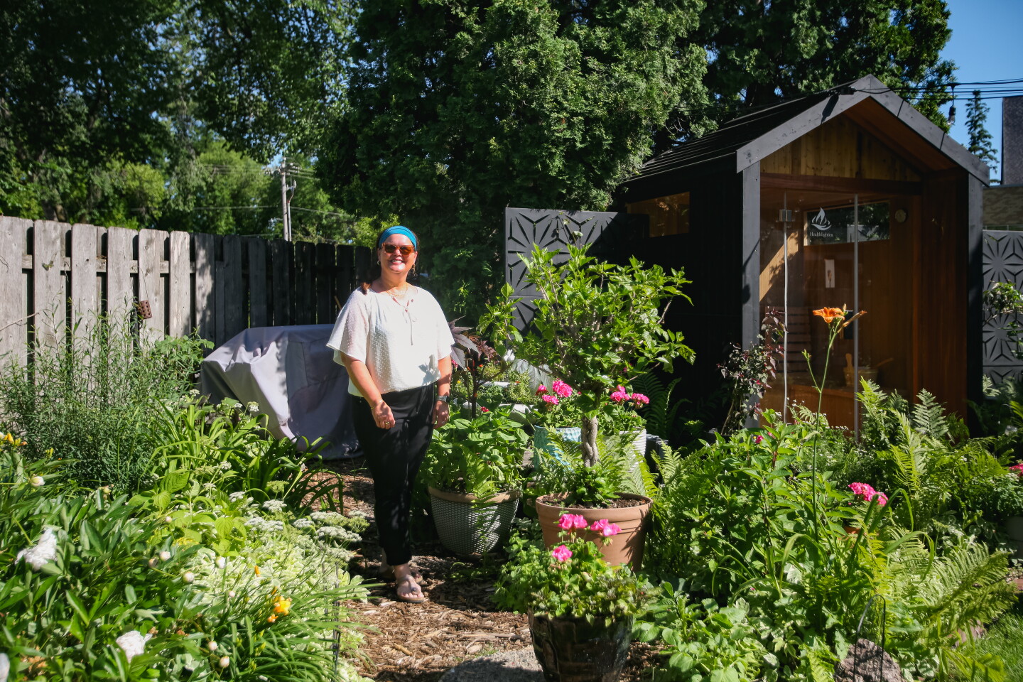 Alyssa Miller is in her backyard garden July 2, 2025, in south Fargo.