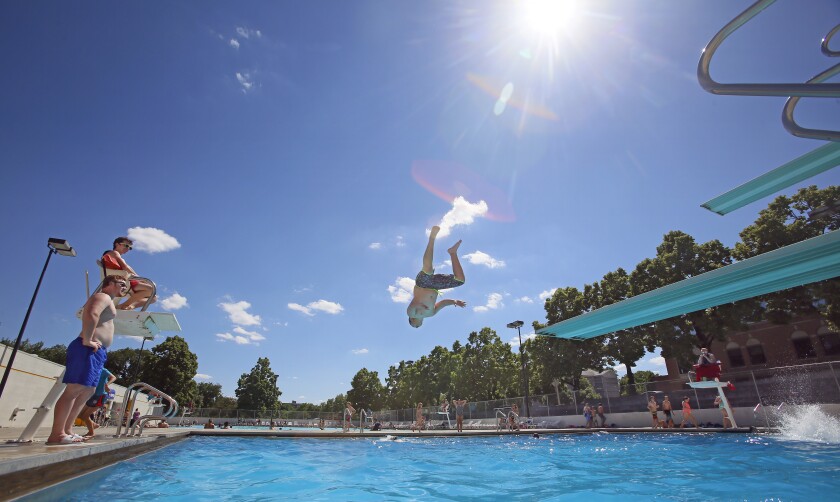 Lifeguards Sean Rider, 23, and Seamus Wicks, 16, watch divers Monday, June 5, 2017, at Island Park Pool in downtown Fargo.David Samson / The Forum