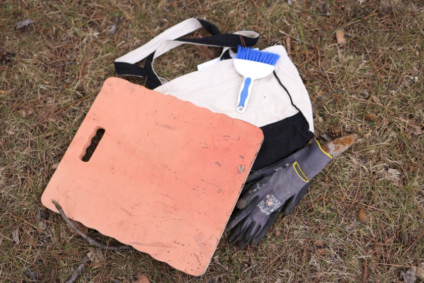 woman documents gravestones