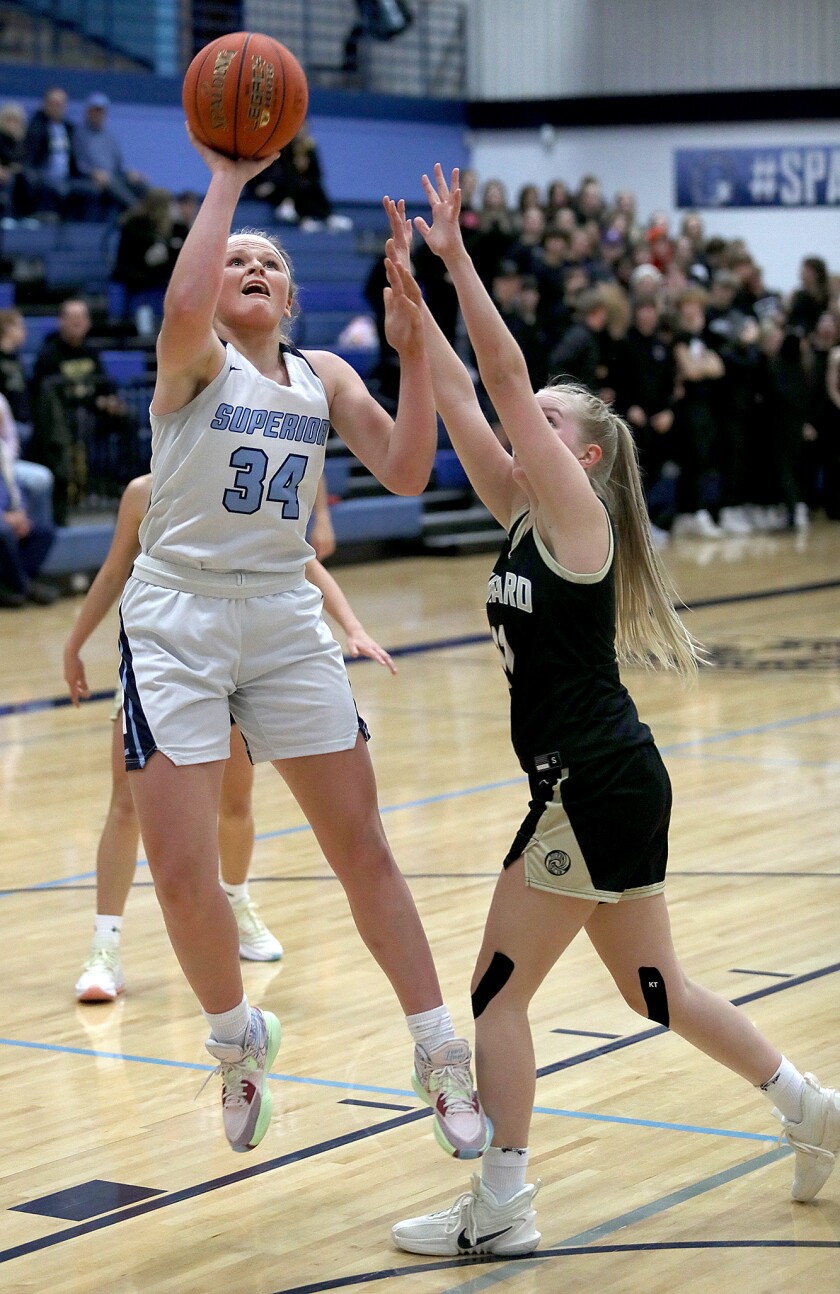 Superior’s Emma Raye (34) shoots over Hayward’s Rachel Miller (11)