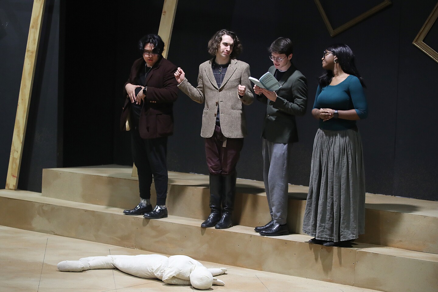 Actors rehearse scene.