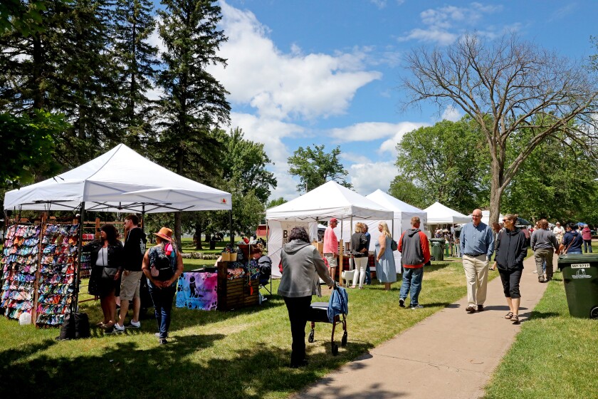 People attend Arts in the Park on Sunday, June 26, 2022, at Gregory Park in Brainerd.