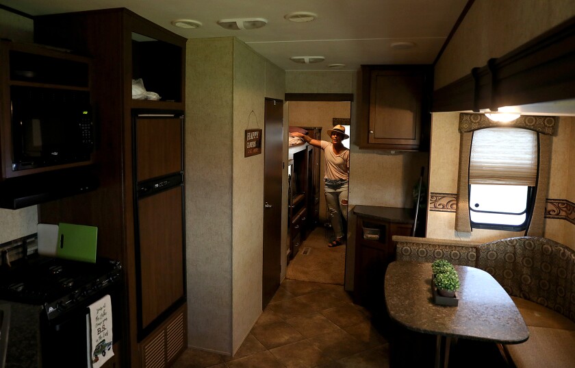 Heidi Breggeman shows some of the extra sleeping areas in her camper at Ray and Marge’s Resort