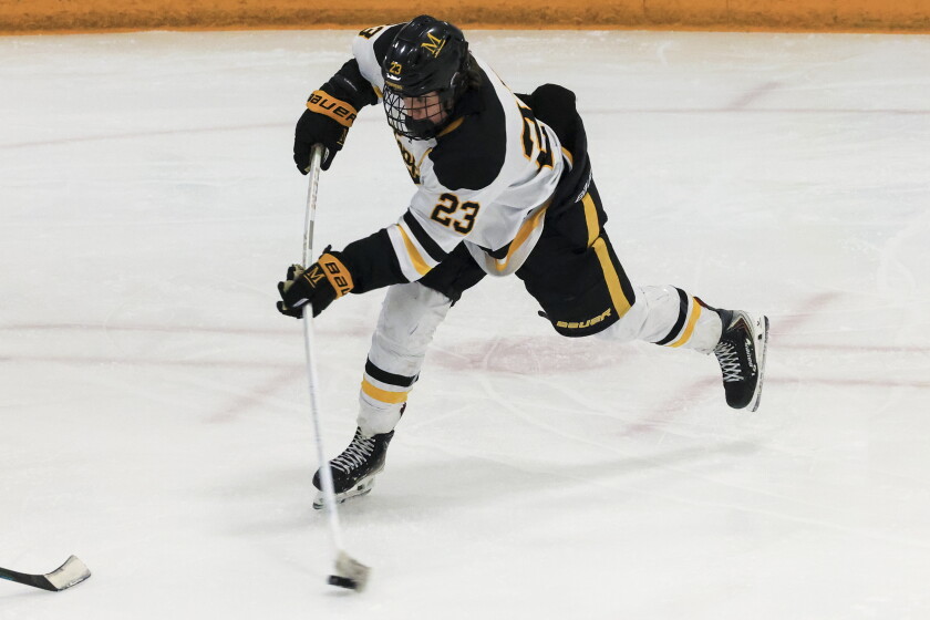 high school boys play ice hockey