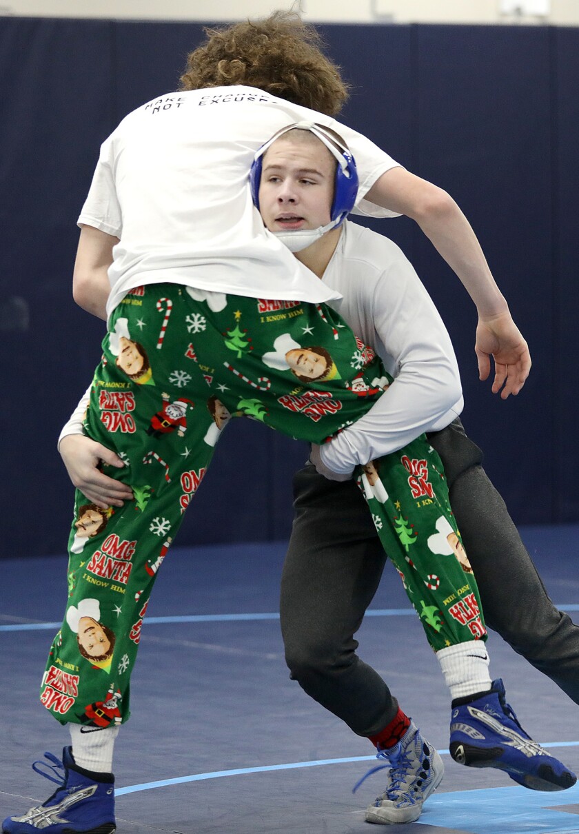 Superior’s Connor Krueger, right, picks up teammate Josh Johnson during practice