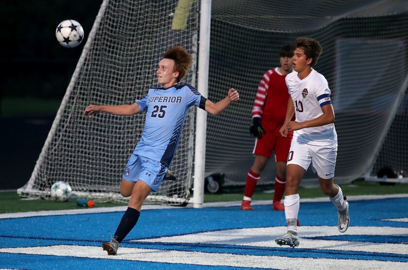 Superior’s Eli Benson (25) clears the ball out of his defensive zone