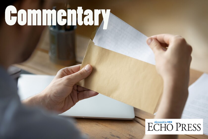 Close up businessman holding envelope with blank paper sheet