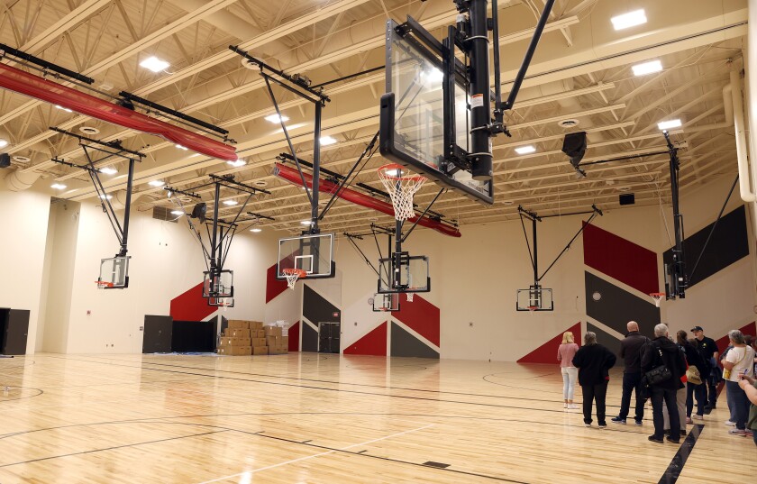 A tour group looks at the gymnasium at the Intermediate School, which also doubles as a tornado shelter due to its hardened construction.