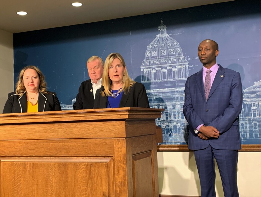 Speaker Melissa Hortman and colleagues after UI deal