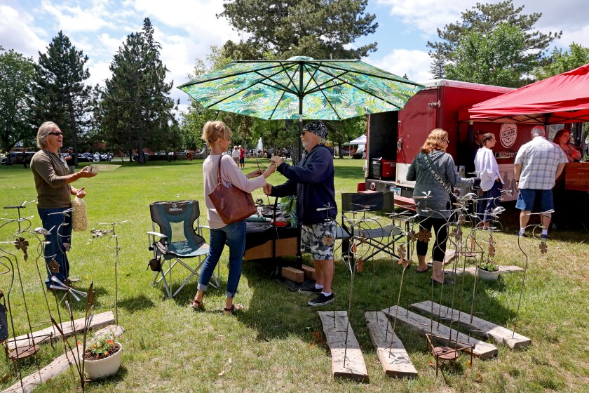 People attend Arts in the Park on Sunday, June 26, 2022, at Gregory Park in Brainerd.