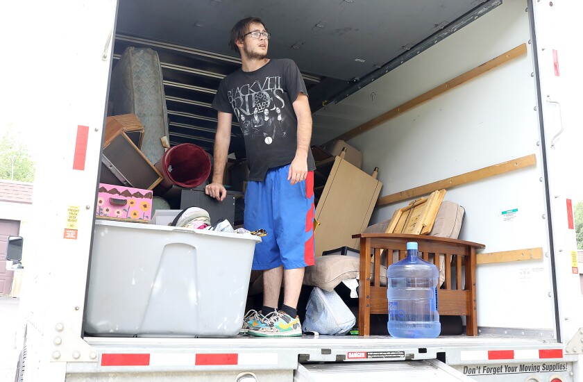 Zach Stirewalt, formerly of Cloquet, looks over to the doors as he moves his mother-in-law to an apartment in Duluth