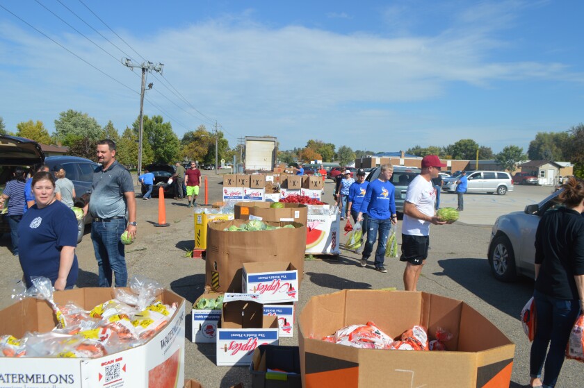 People gather at a previous distribution site hosted by the Great Plains Food Bank in North Dakota.