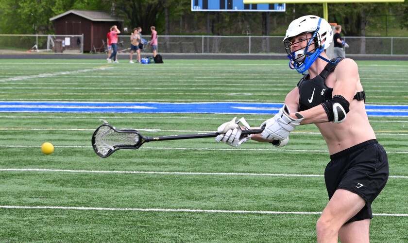 boy playing lacrosse