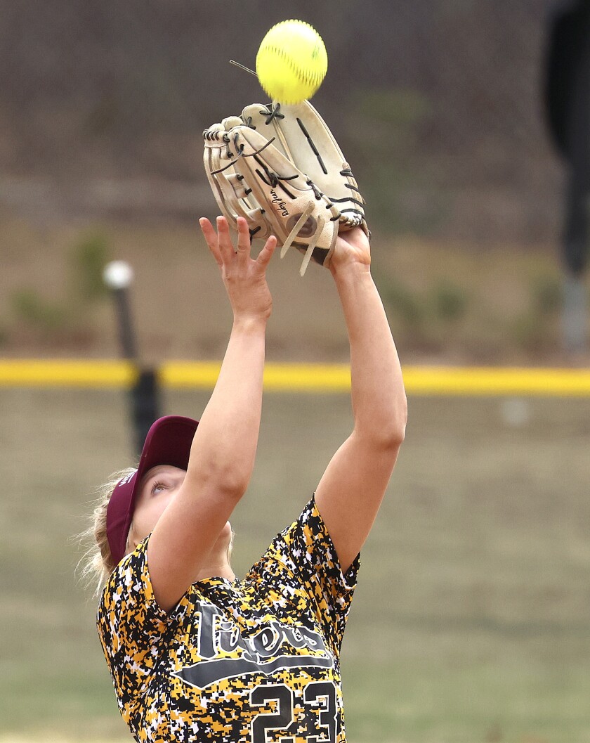 Northwestern softball players in action.