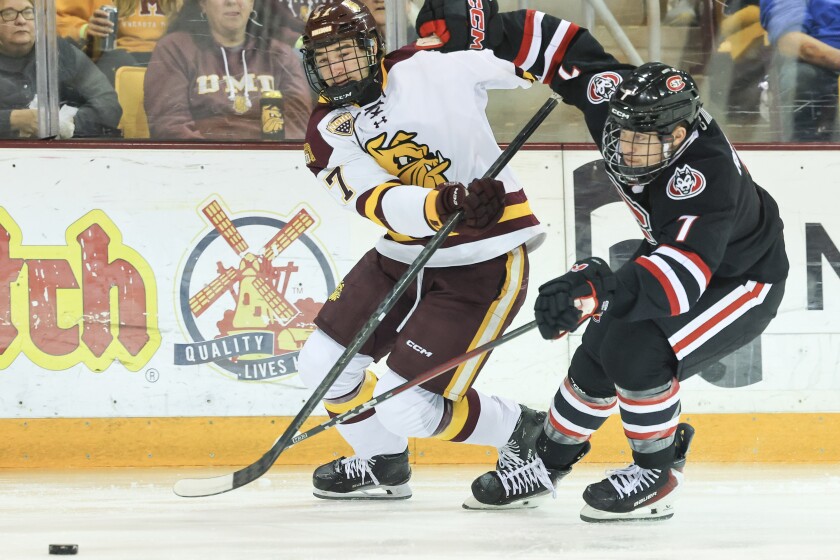 college men play ice hockey