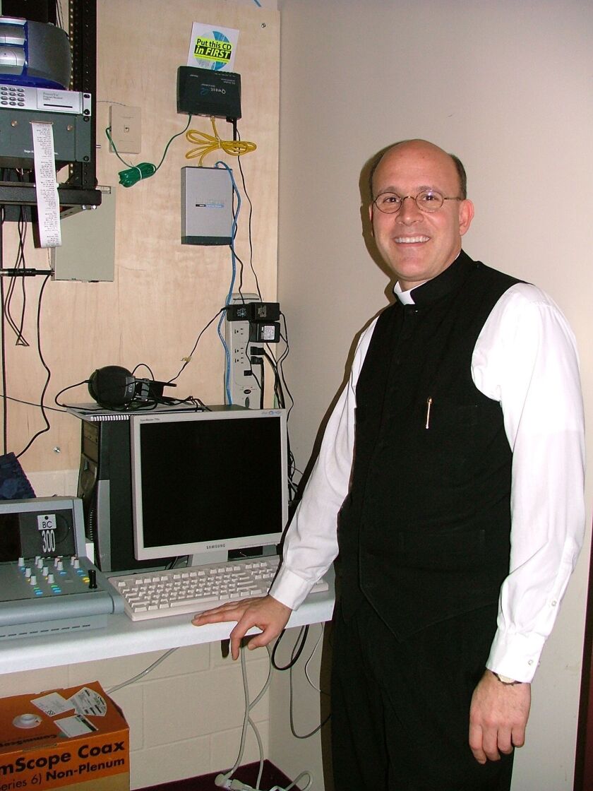 RPR_Fr. Raymond Courtright at first studio, a closet at the UND Newman Center, Grand Forks, 2004.jpg