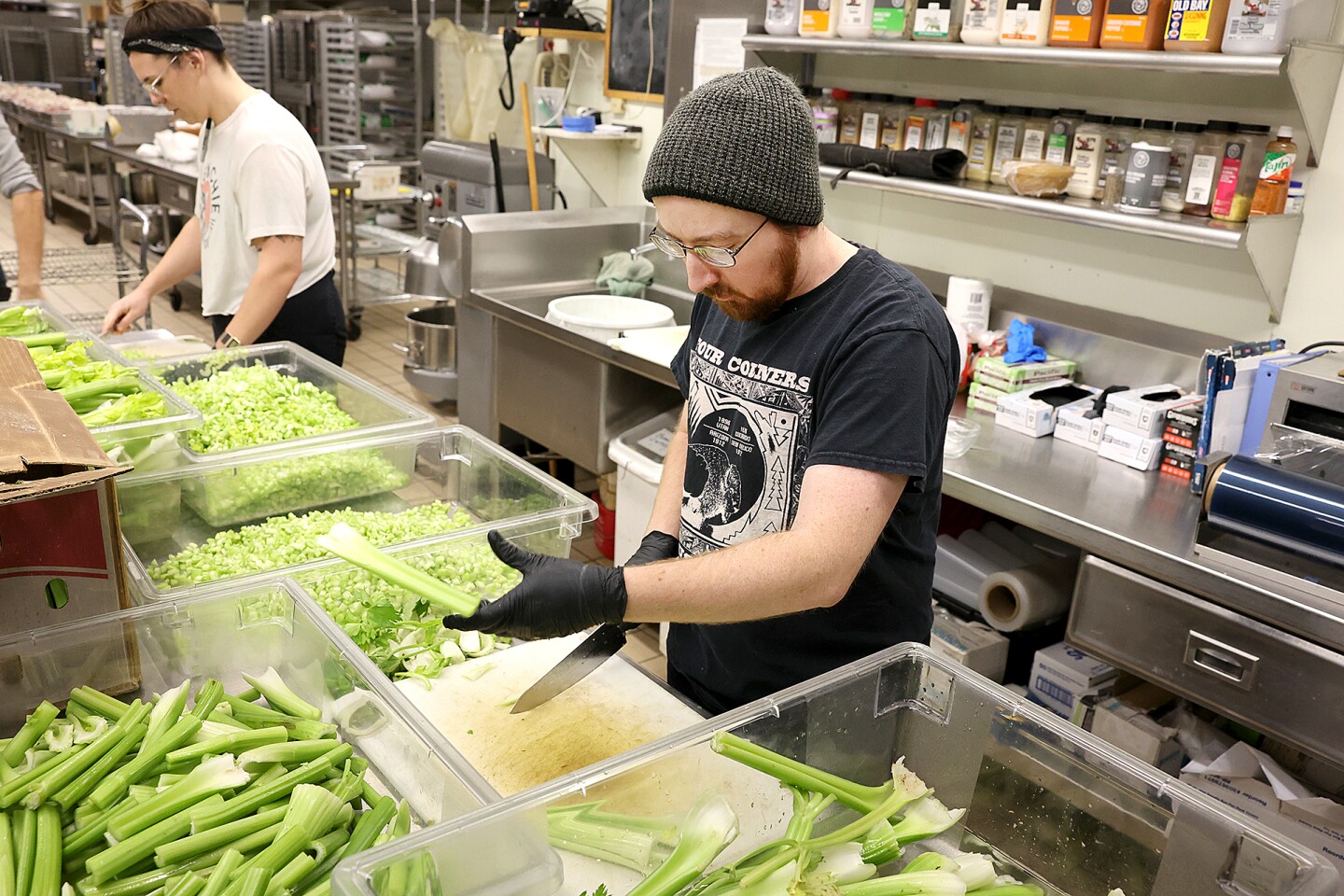 Man cuts celery.