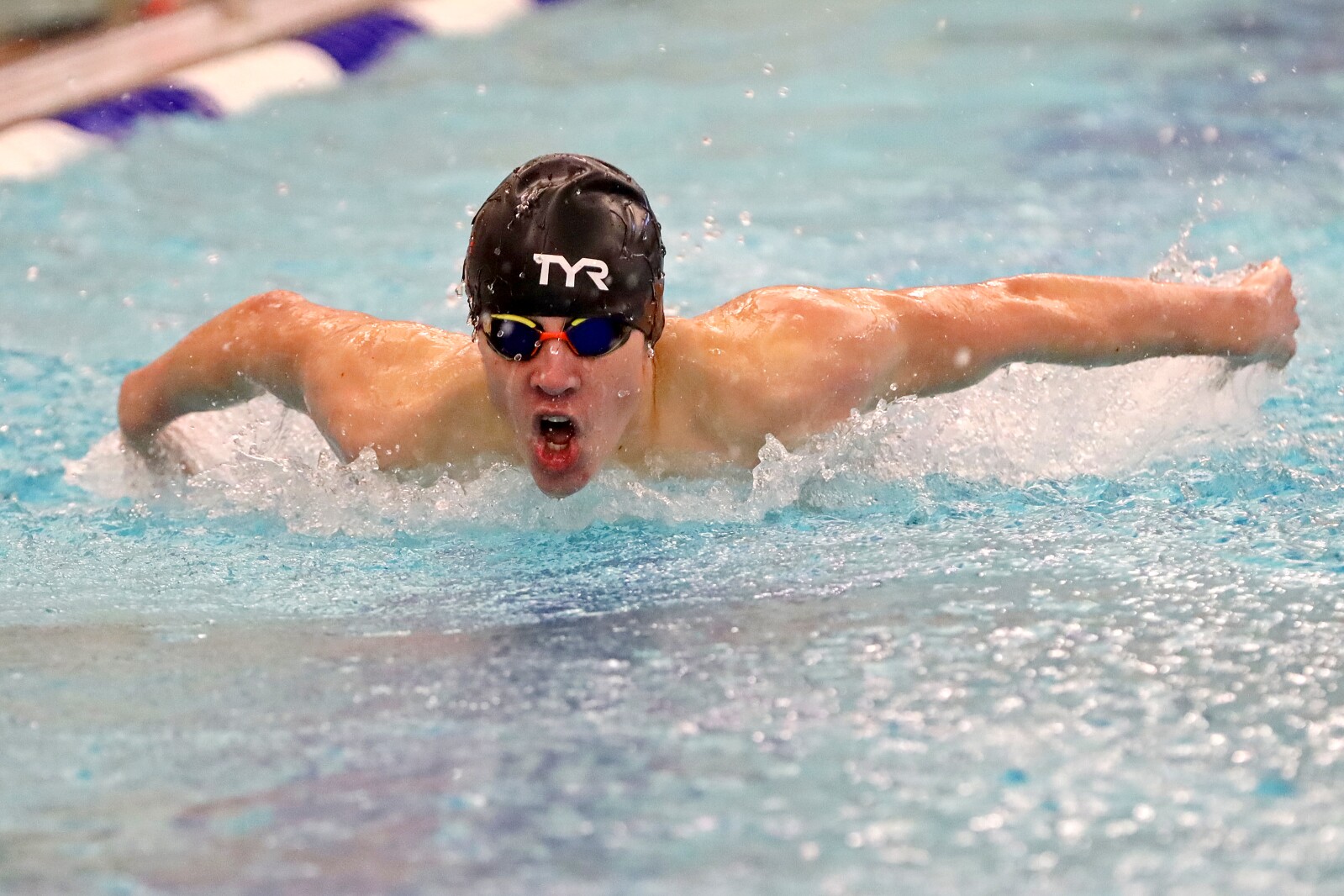 Swimmer in the pool competing.