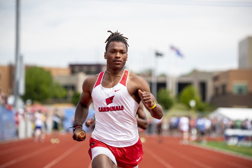 Michael Price of Willmar crosses the finish line in the 4x100 during the Class AA state track and field championships at St. Michael on Saturday, June 11, 2022.