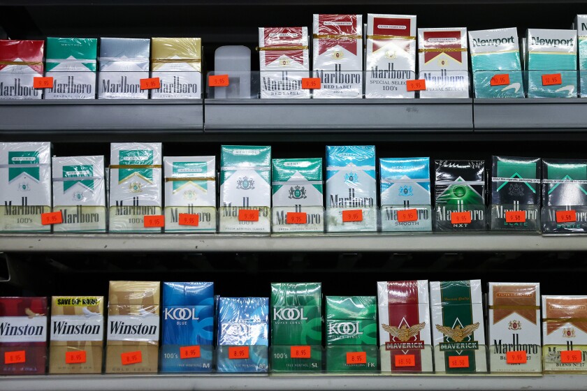 Packs of menthol-flavored and non-menthol cigarettes are displayed for sale in a smoke shop on April 28, 2022 in Los Angeles.
