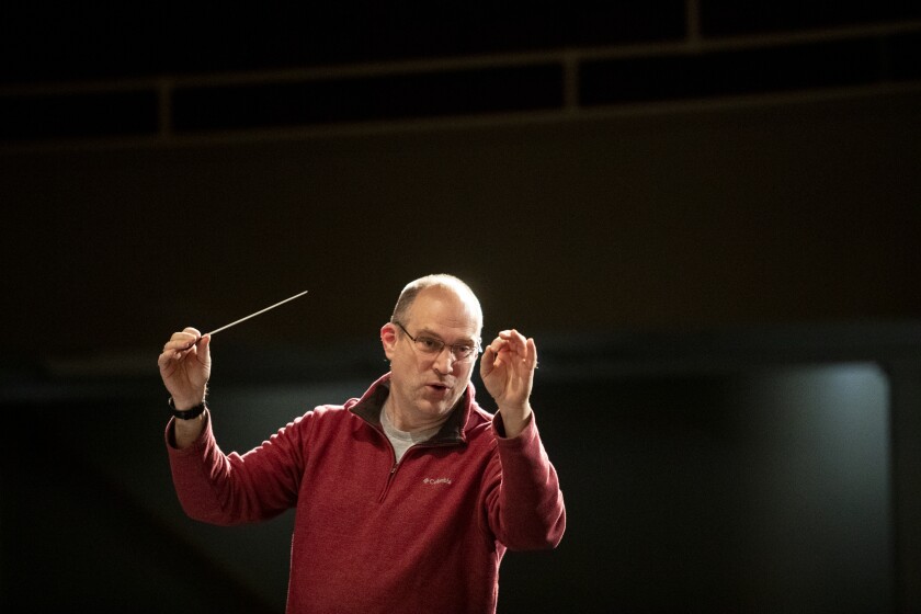 Prairie Winds Concert Band director Brock Duncan directs the band during a practice session for "Music in Color" on Monday, April 18, 2022, at the Willmar Education and Arts Center.