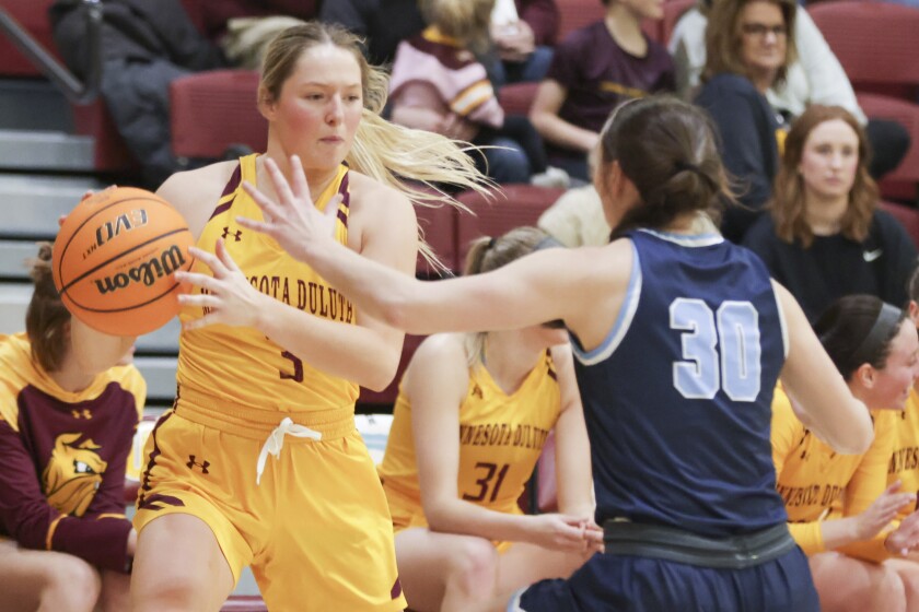 College women play basketball
