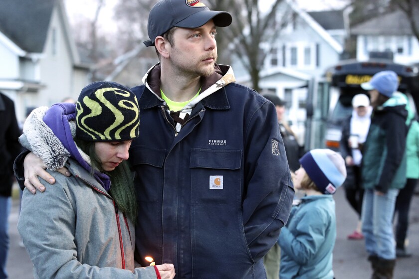 Vigil held for slain family.