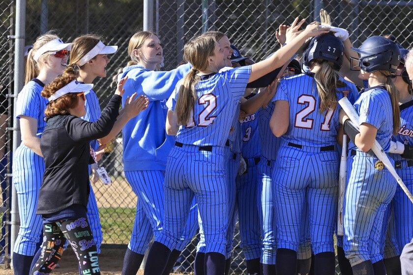 high school girls play softball