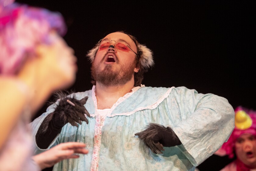 The Big Bad Wolf, played by Chriss Ness, sings with fellow fairy tale characters during a dress rehearsal of Shrek the Musical at the Barn Theatre on Saturday, June 4, 2022.